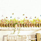 Hyggelig wallsticker med et lille hegn, blomster, sommerfugle mm size  50x70cm Am 7077