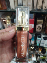 Huda Beauty N.Y.M.P.H. All Over Body Highlighter – Liquid Illuminator for Face, Body &amp; Legs – Water-Based, Long-Lasting Glow – 35 ml