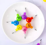 4 Pcs Smiley Cartoon Stationery Pencils – Fun Rainbow Pens with Cute Funny Faces for Kids, Students, and Gifts (Random Color)