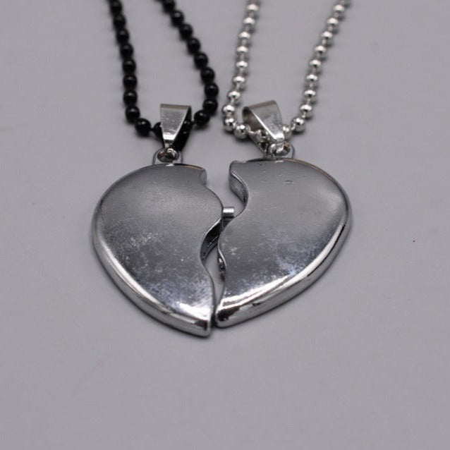 Antique broken heart shape silver locket with silver & black chainantique broken heart shape silver locket with silver & black chaing