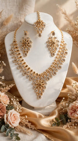 Golden Leaf Zircon Bridal Set - Necklace + Long Earrings + Maang Tikka. Leaf shape champagne & white zircon, heavy floral design, royal shine. Shadi / Engagement / Party ke liye perfect, box included.