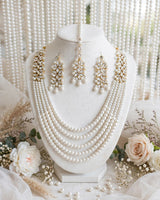 5-Layer Pearl Nikkah Bridal Set - Choker + 5 Layer Long Mala + Earrings + Maang Tikka. White pearls + white kundan zircon + pearl drop latkan, gold polish. Nikkah / Walima ke liye best, white dress ke sath royal look.