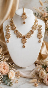 Premium Champagne & Pearl Bridal Set - Necklace + Earrings + Maang Tikka. Square champagne zircon, floral leaf design, small moti pearls, teardrop pendant. Shadi/Party ke liye royal look.