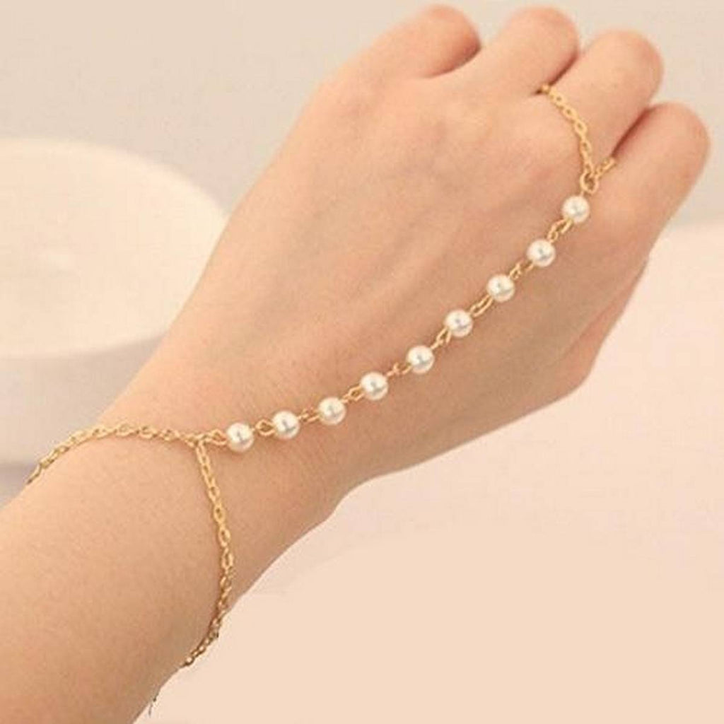 Hand bracelet with attached chain to finger ring